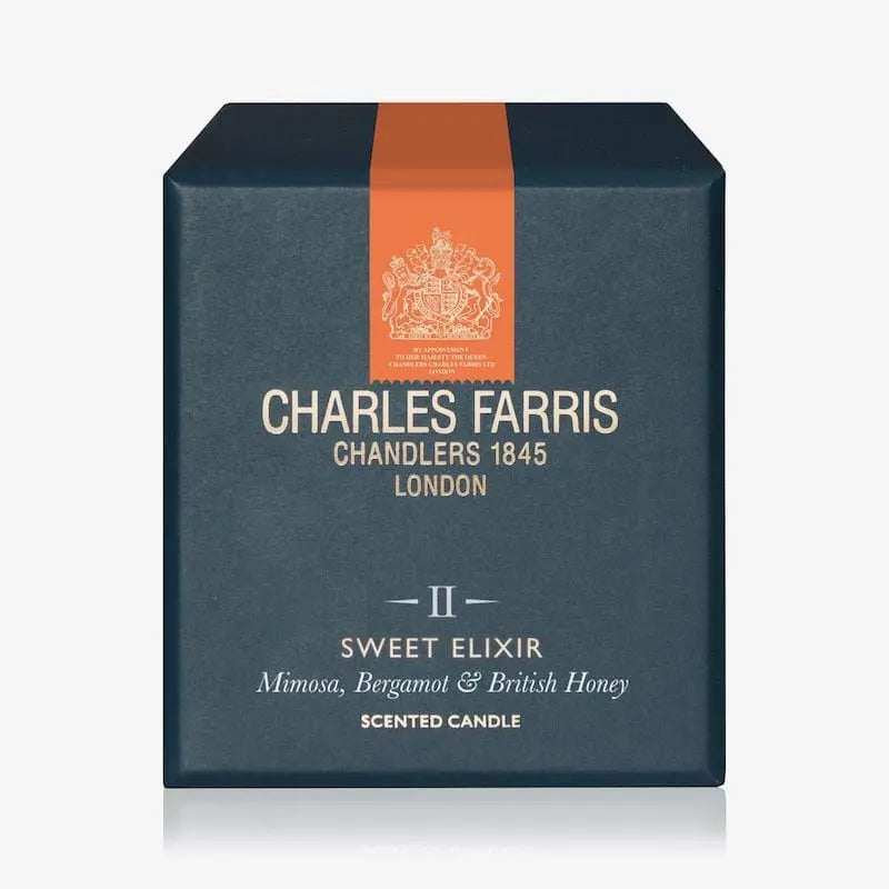 Charles Farris scented candle box with an orange ribbon on a white background