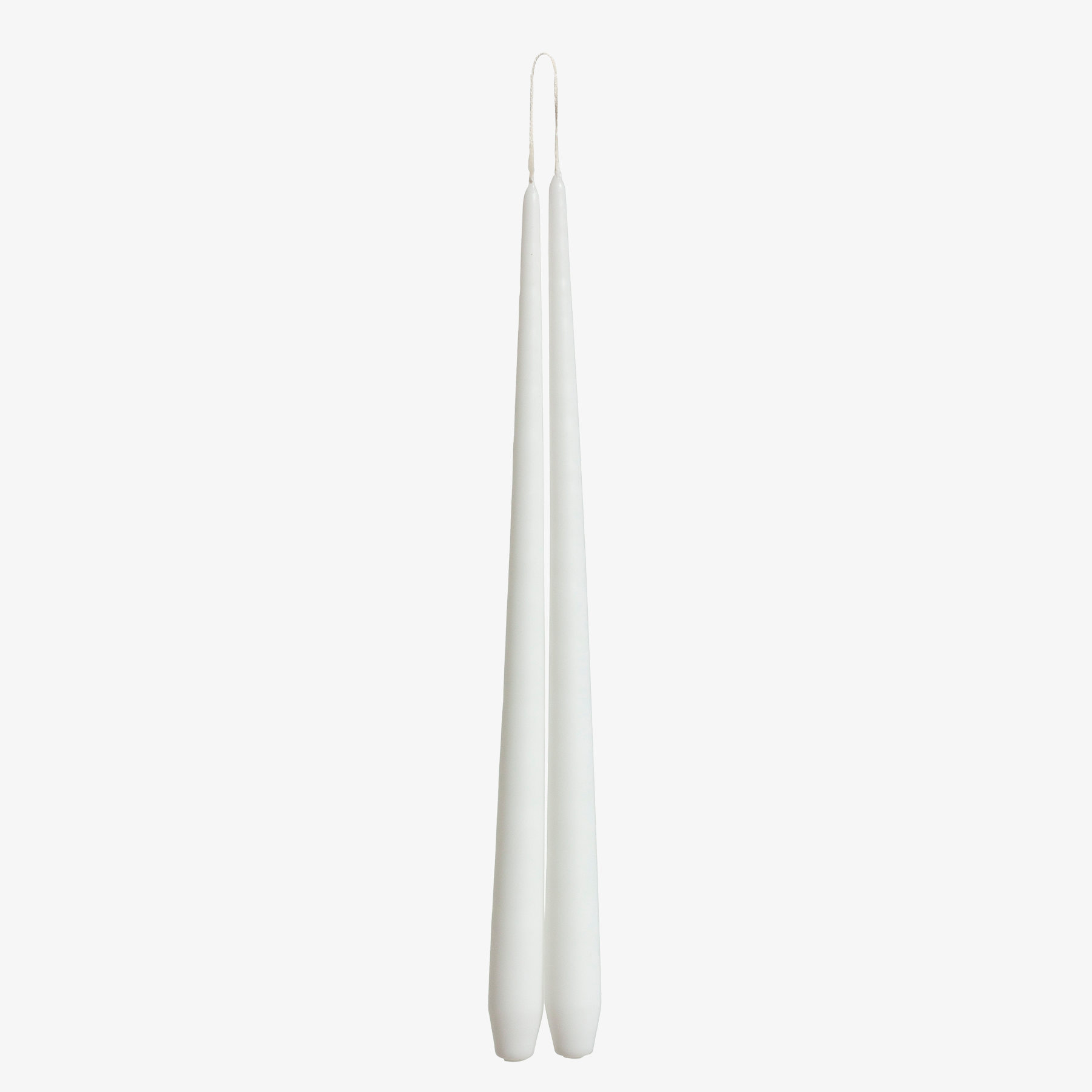 Two white candles on a white background