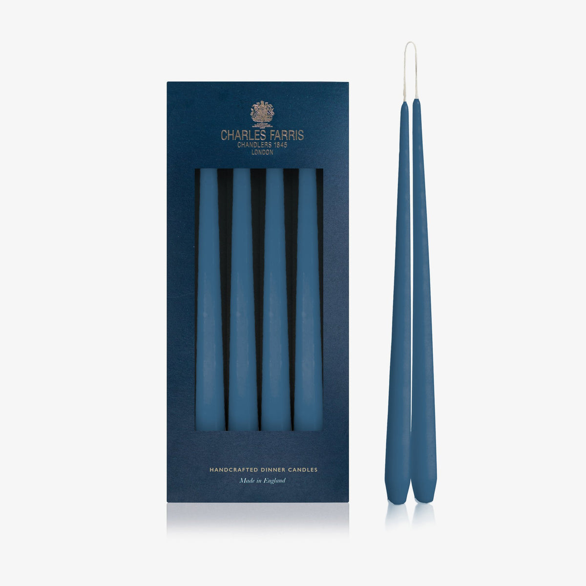 Charles Farris Deep Ocean hanging pair dinner candles in their navy box, with one pair joined at the wick, made in England