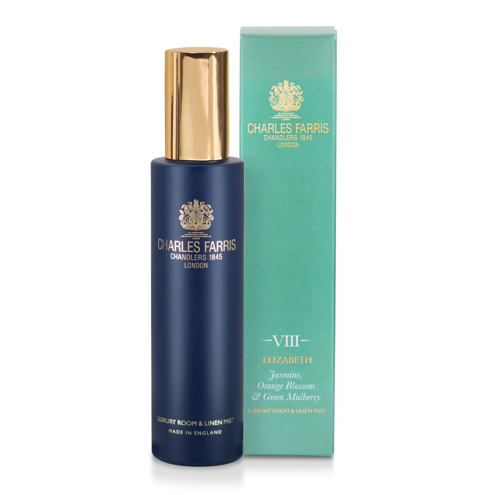 Charles Farris Elizabeth room mist scented home spray orange blossom, jasmine & mulberry in navy blue bottle next to its blue packaging.