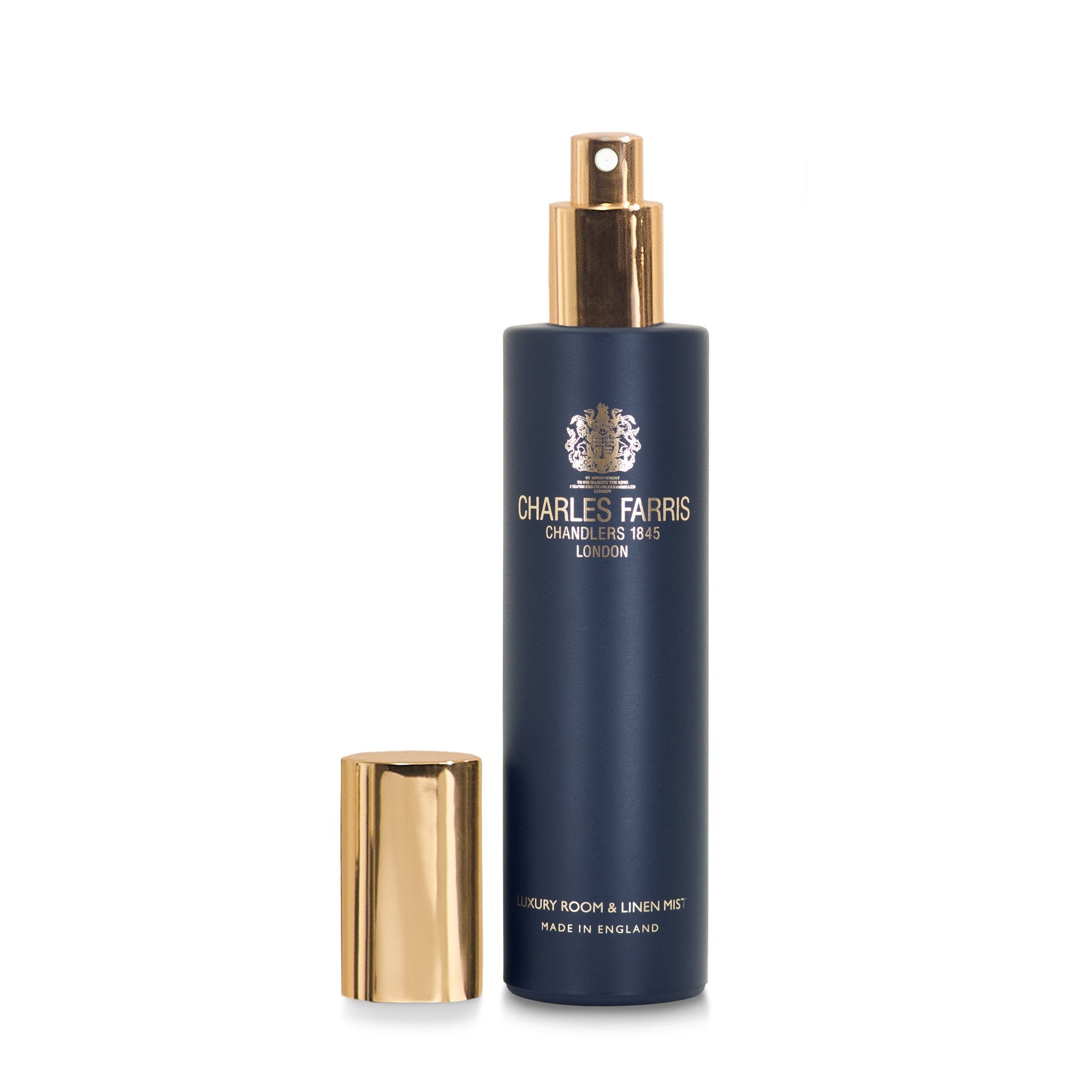 Charles Farris 100ml luxury room and linen mist, navy bottle with the gold cap removed to show the fine spray nozzle