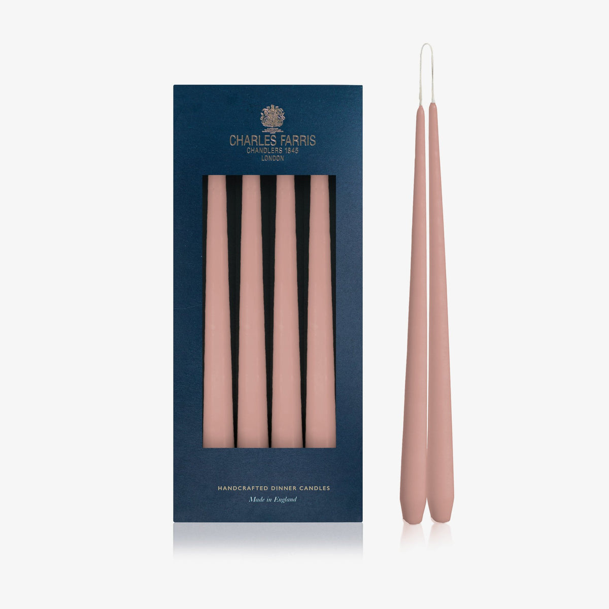 Charles Farris Musky Pink hanging pair dinner candles in their navy box, with one pair joined at the wick, made in England