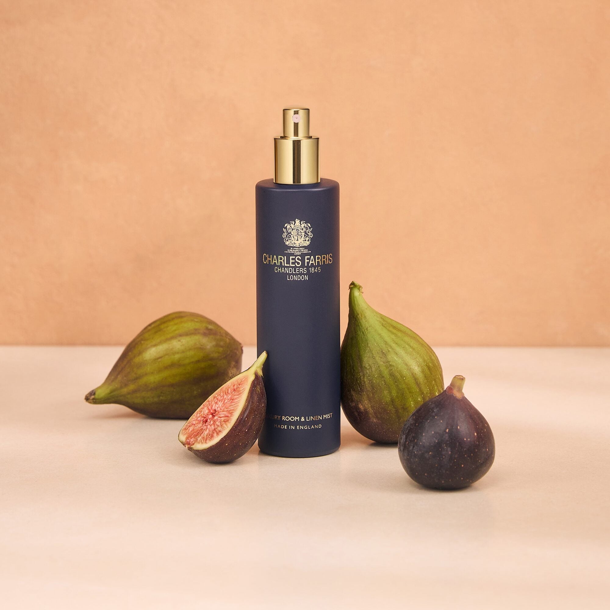 Charles Farris Redolent Fig with wild fig cassis, amber and green notes room mist scented home spray in navy blue bottle.
