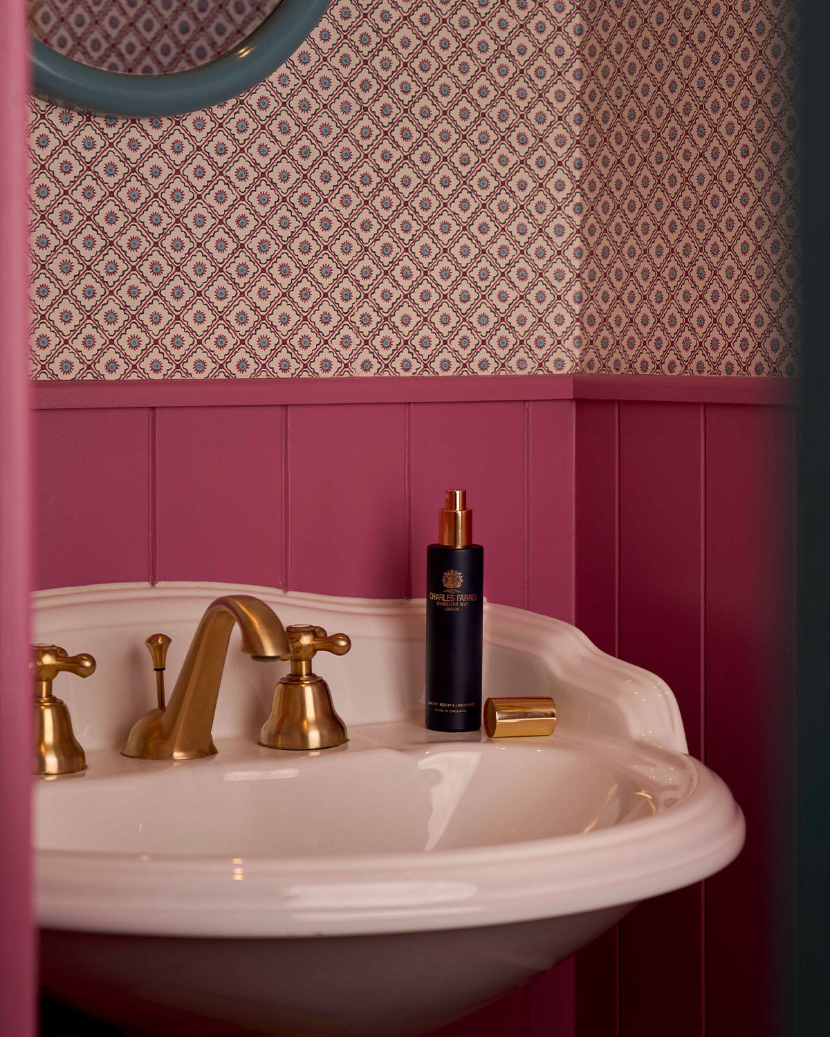 Charles Farris signature scented room sprays and linen mists in a pink bathroom