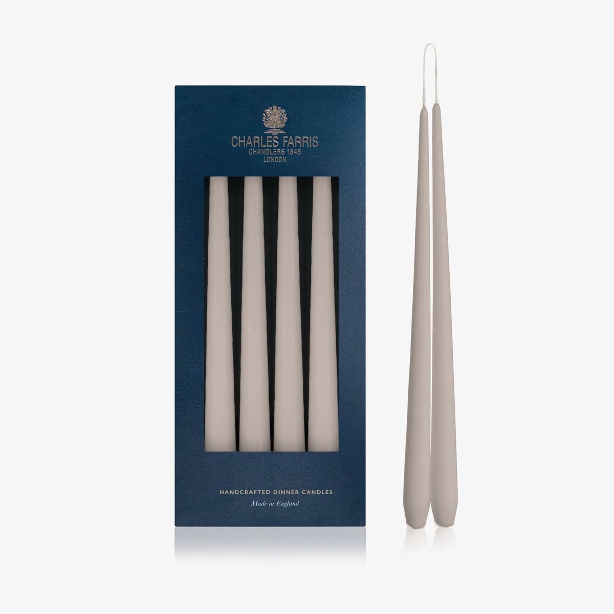 Charles Farris Taupe hanging pair dinner candles in their navy box, with one pair joined at the wick, made in England