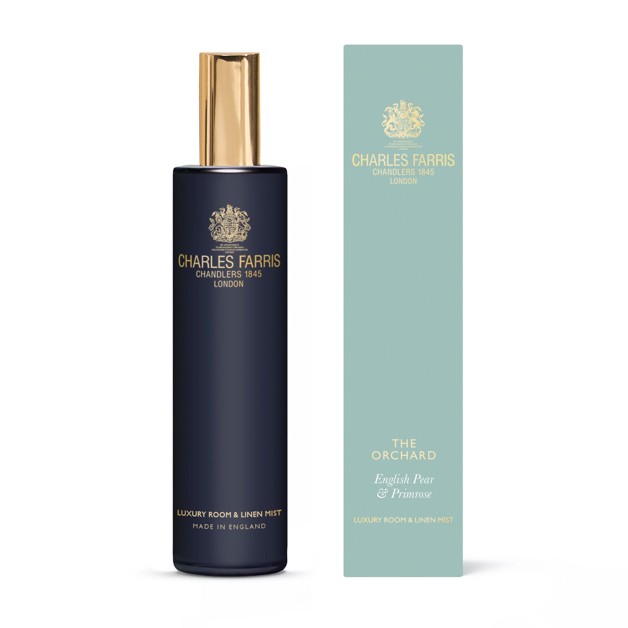 Charles Farris Orchard pear, jasmine fresia room mist scented home spray next to its blue packaging.