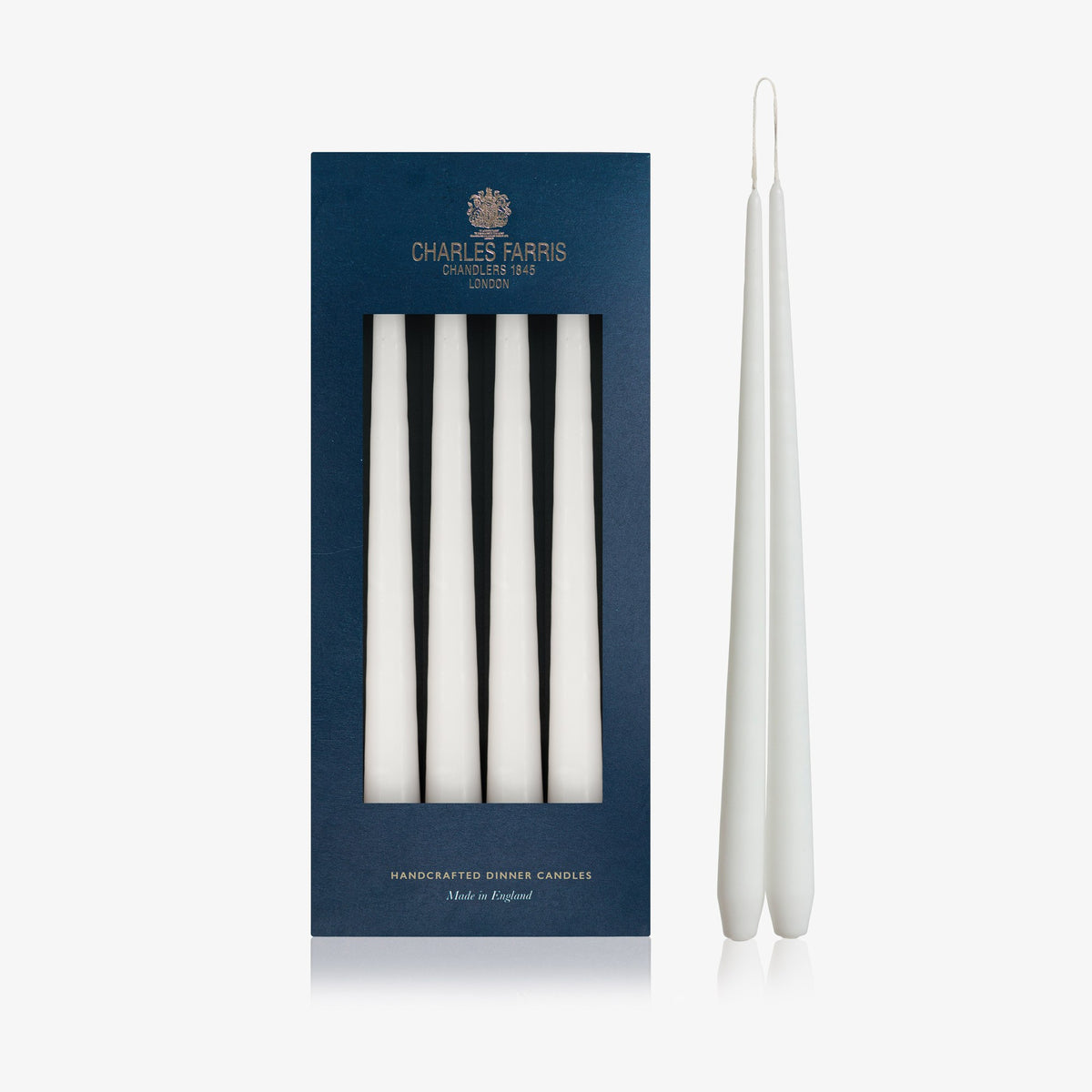 Charles Farris White hanging pair dinner candles in their navy box, with one pair joined at the wick, made in England