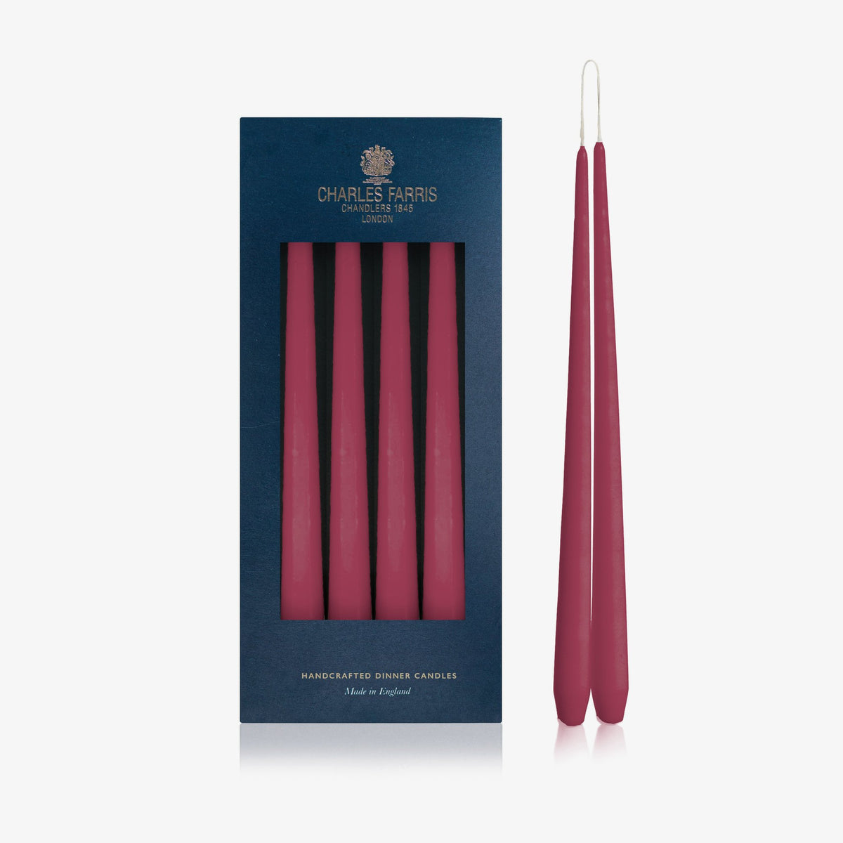 Charles Farris Wine Red hanging pair dinner candles in their navy box, with one pair joined at the wick, made in England