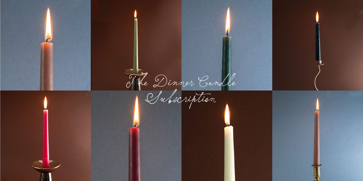 The Dinner Candle Subscription by Charles Farris: eight lit taper dinner candles in seasonal colours on blue and brown backdrops