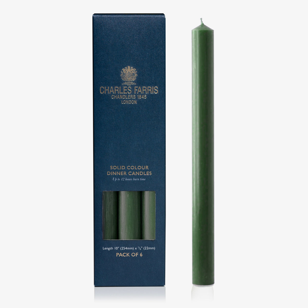 Charles Farris evergreen dinner candle beside its navy box, pack of 6, up to 12 hour burn, made in England