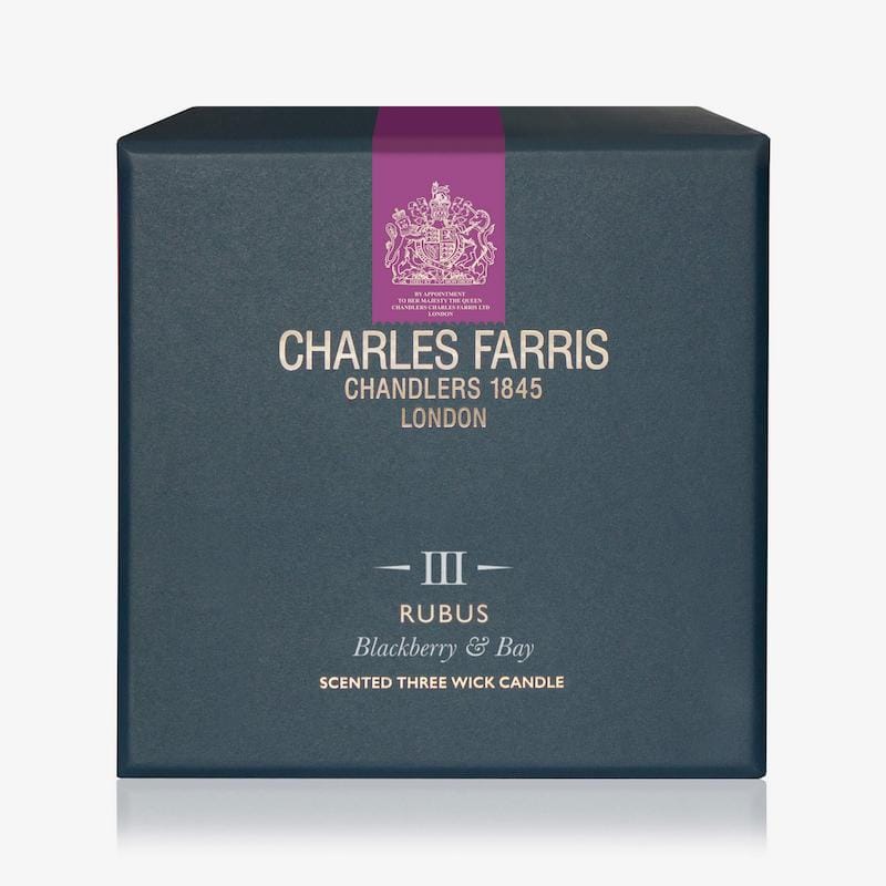 Blue candle box with 'Charles Farris' branding on a white background