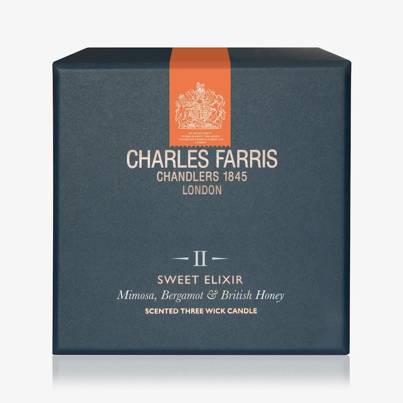 Blue candle box with 'Charles Farris' branding on a white background