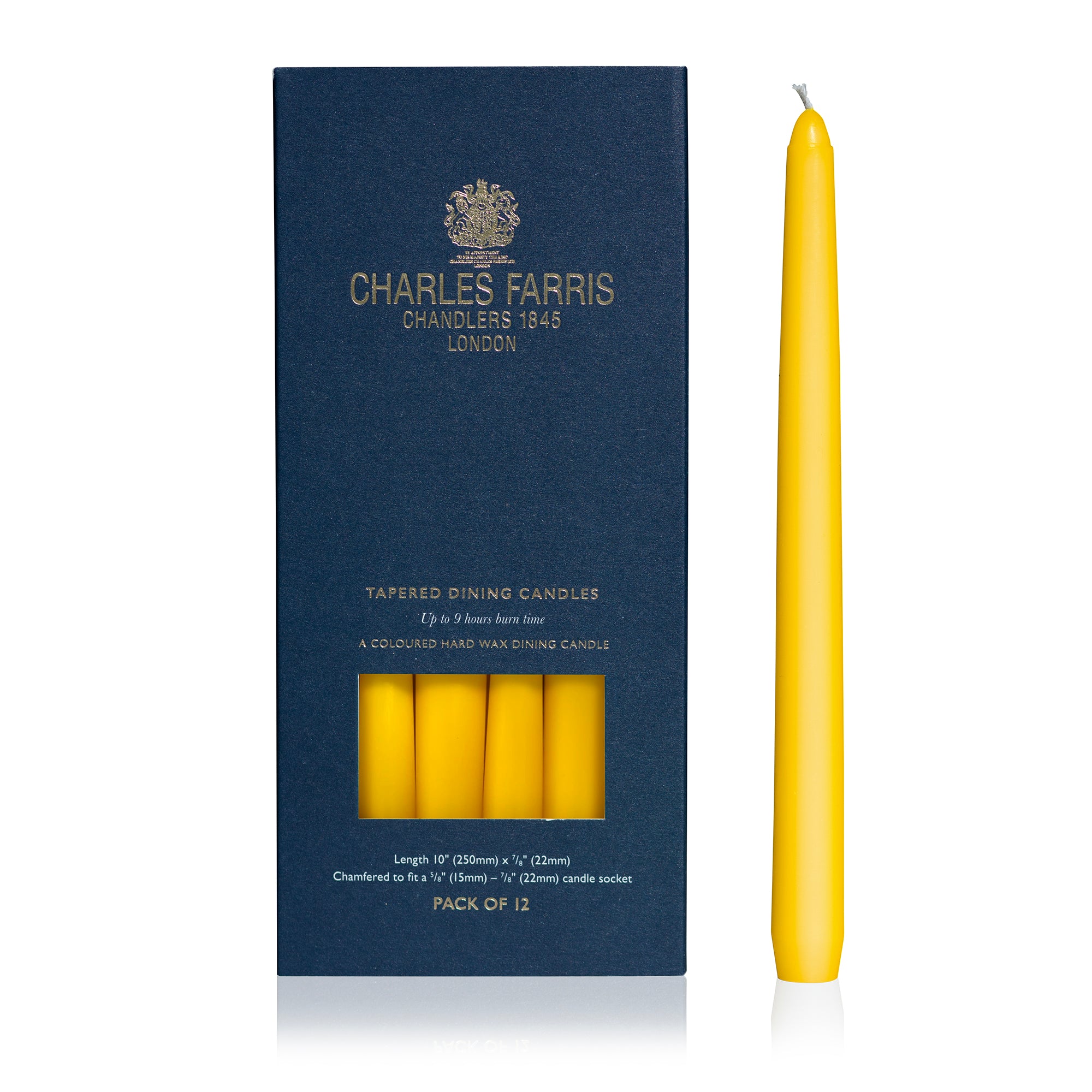 A navy blue box of Charles Farris tapered dining candles next to a single yellow candle on a white background.