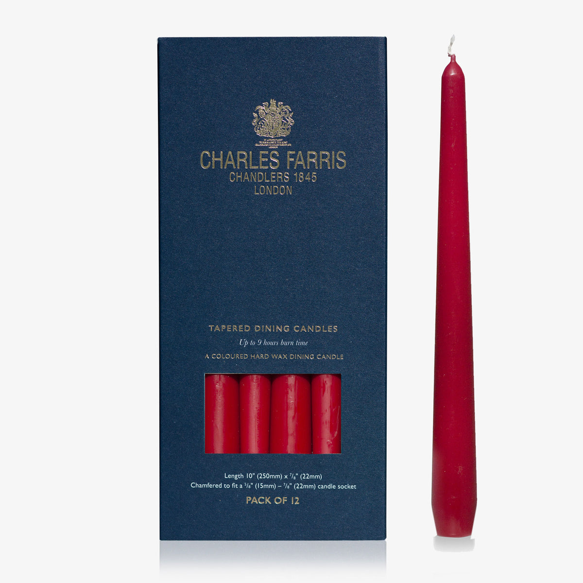 Charles Farris wine red tapered dinner candle beside its navy box, pack of 12, 9 hour burn, made in England