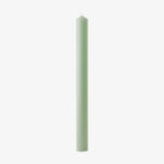 green coloured tapered candle