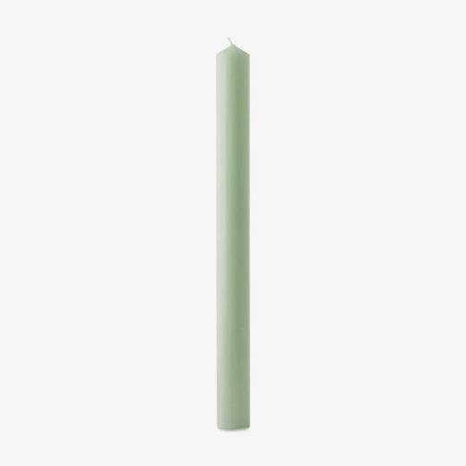 green coloured tapered candle