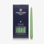 green coloured tapered candles