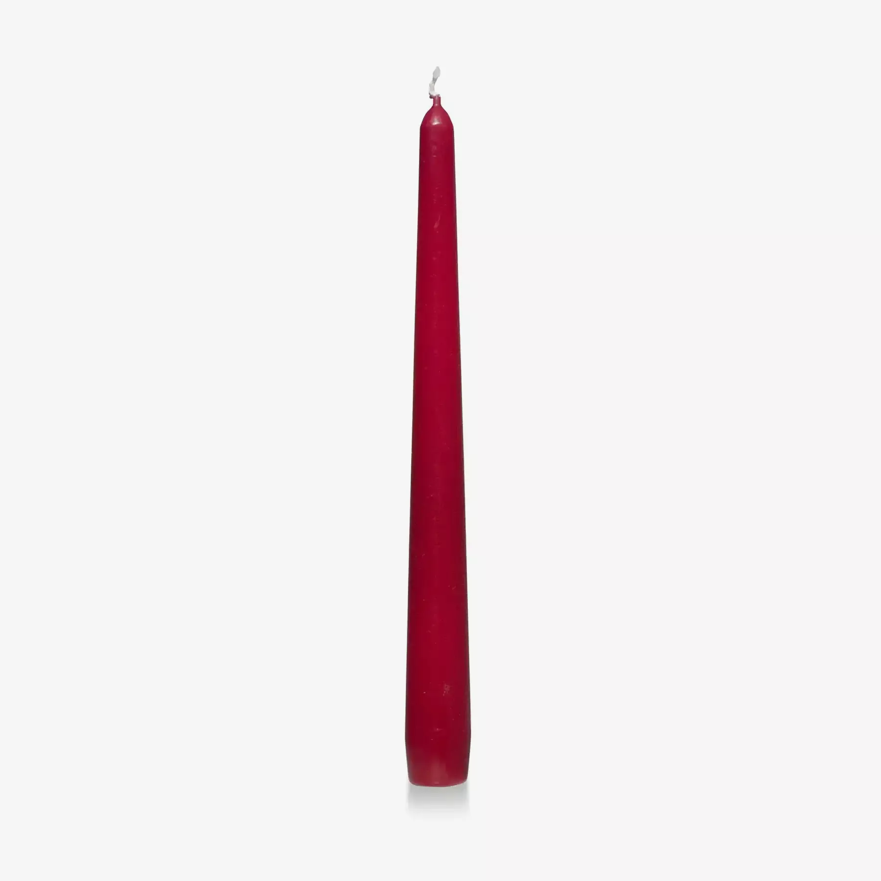 red coloured tapered candle